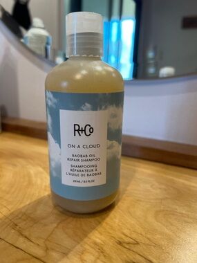 R+Co On A Cloud Baobab Oil Repair Shampoo - Blue and White Bottle